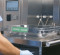 Endoscope tray with clean label on top of a specialized cart designed for safe transport of five scope trays